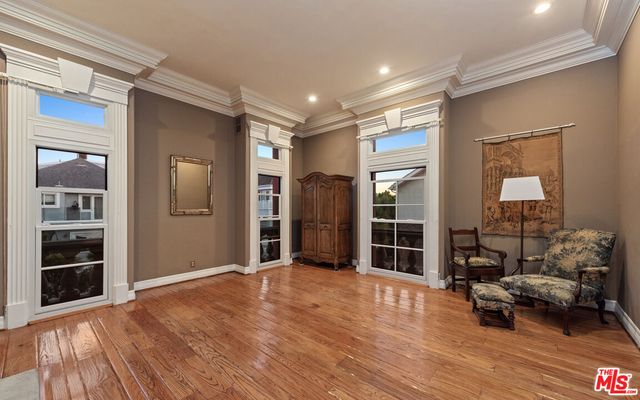 a view of a livingroom with furniture and a window