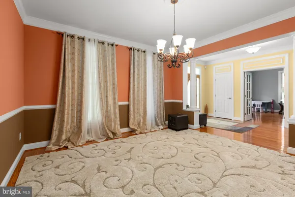 a living room with furniture window and a flat screen tv