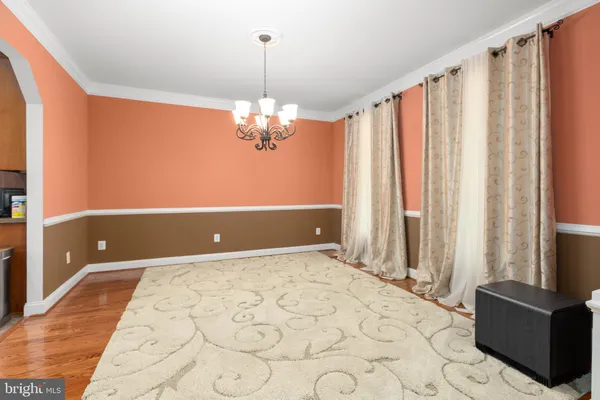 a living room with furniture fireplace and a large window