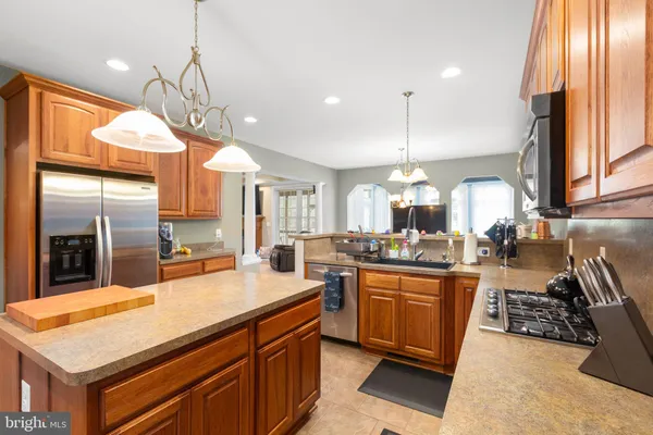 a view of walk in closet with clothes