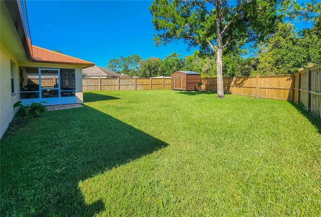 a living room with furniture a rug and a window