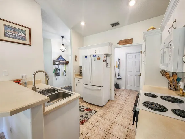 a kitchen with stainless steel appliances a refrigerator and a stove