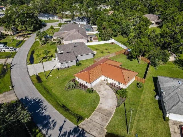 an aerial view of a house with a swimming pool