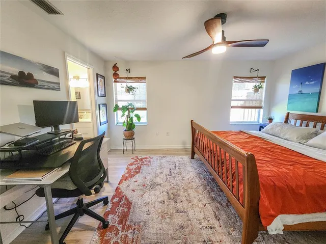 a bedroom with furniture and a window