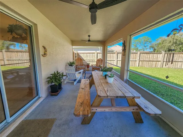 a view of swimming pool with seating area