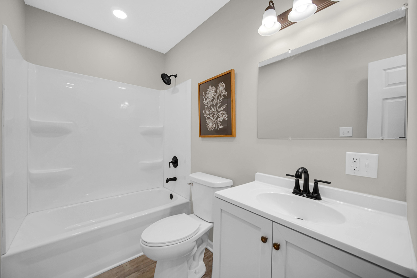 1376 Lennington Circle Northwest Kankakee, IL 60901 - Photo 11 of 16 a bathroom with a sink a toilet and a bathtub