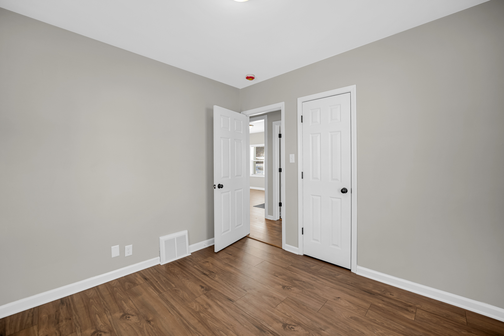 1376 Lennington Circle Northwest Kankakee, IL 60901 - Photo 13 of 16 a view of an empty room with wooden floor
