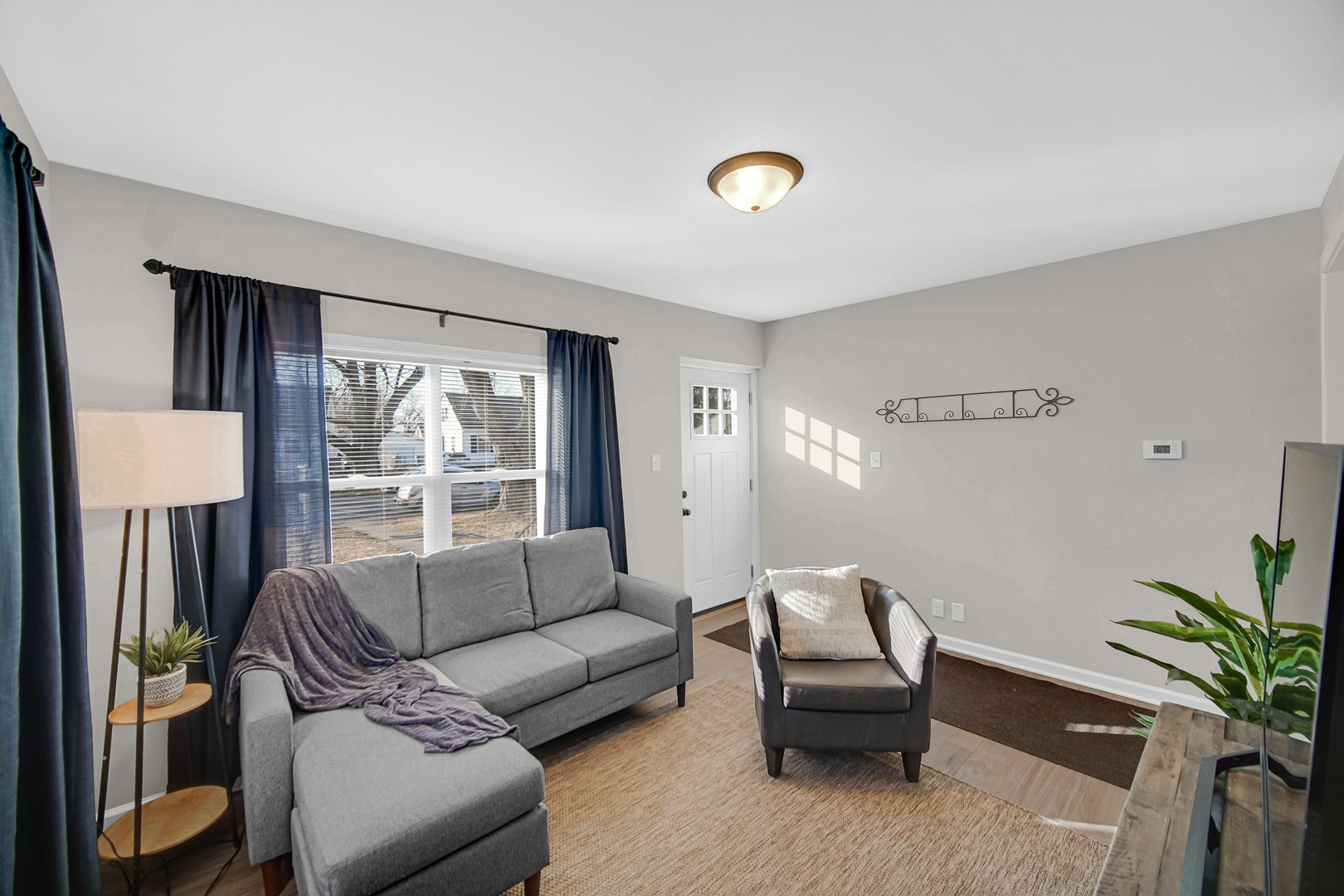 1376 Lennington Circle Northwest Kankakee, IL 60901 - Photo 2 of 16 a living room with furniture and a large window