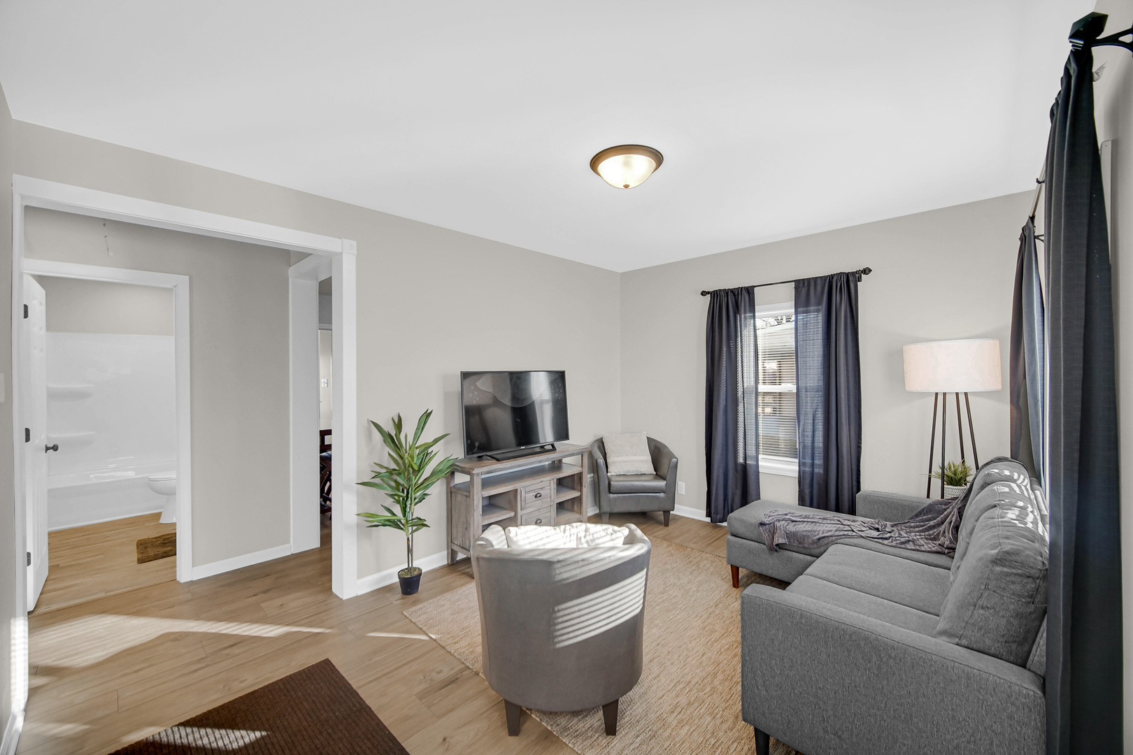 1376 Lennington Circle Northwest Kankakee, IL 60901 - Photo 3 of 16 a living room with furniture and a flat screen tv