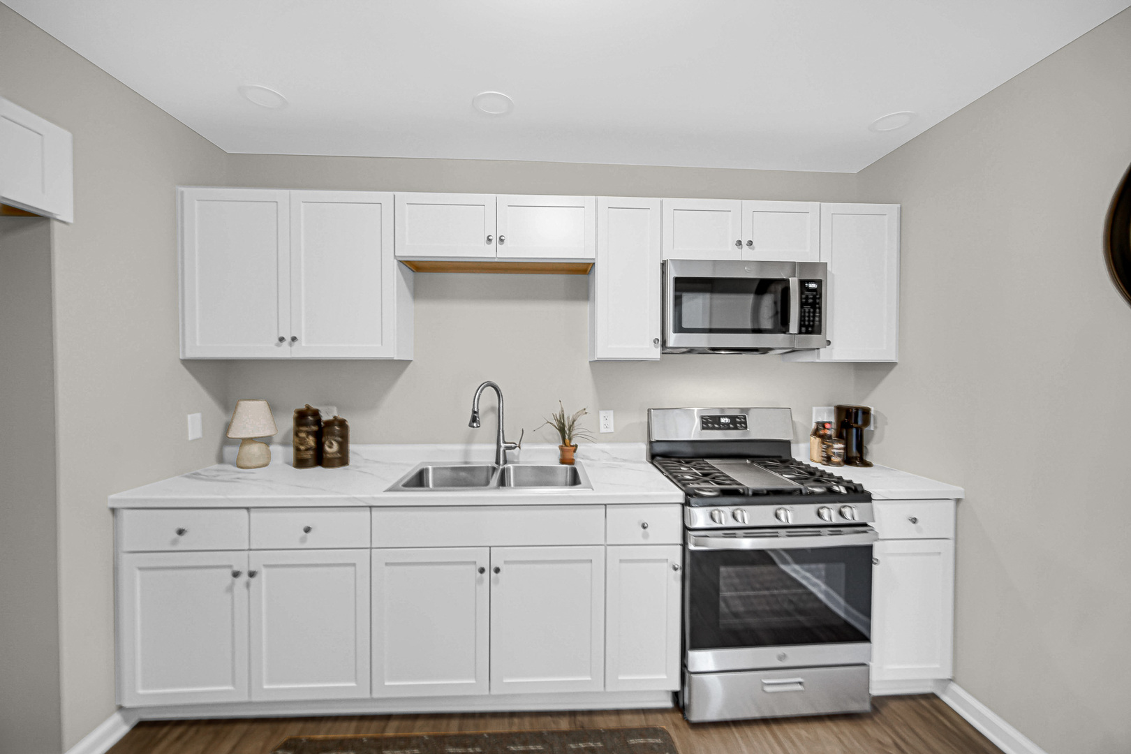 1376 Lennington Circle Northwest Kankakee, IL 60901 - Photo 7 of 16 a kitchen with stainless steel appliances granite countertop a sink and a stove
