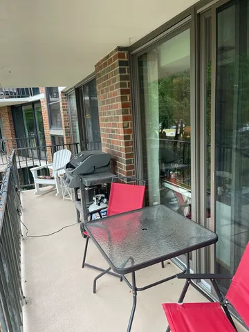 a view of a workspace with furniture