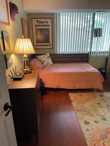 a bedroom with furniture and a window