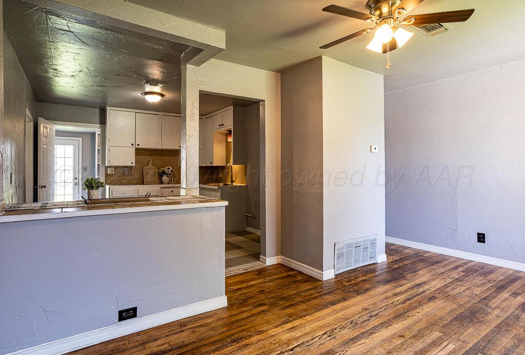 4103 Bowie Street Amarillo, TX 79110 - Photo 3 of 21 Living Room to Kitchen
