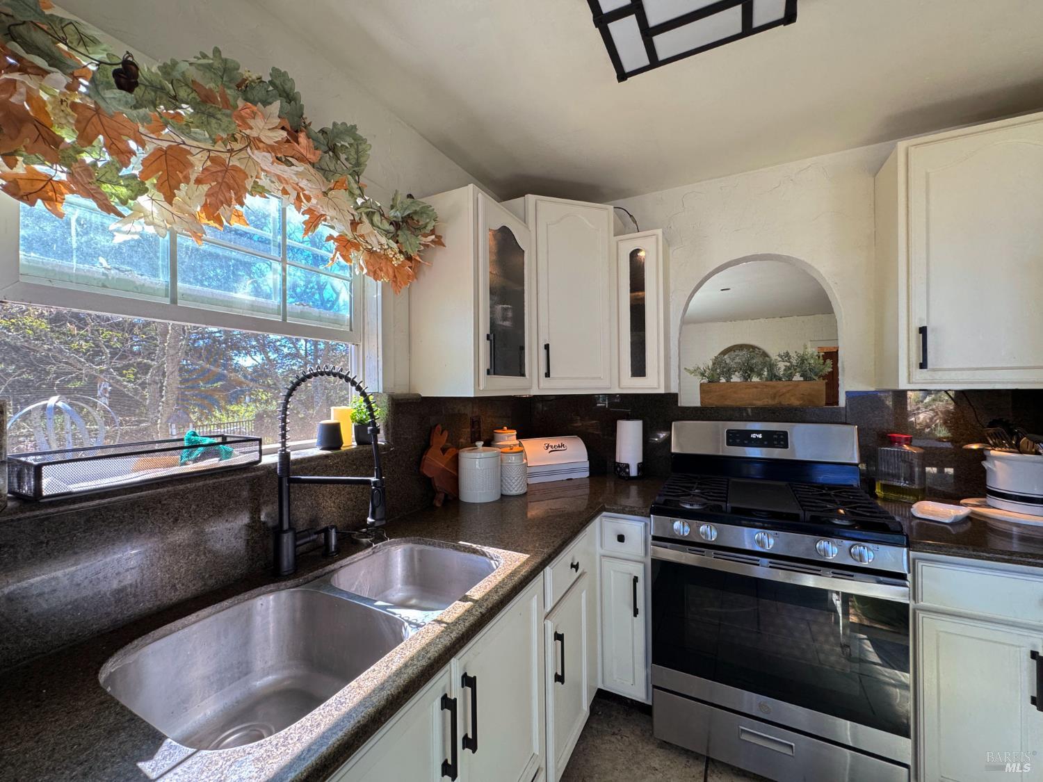 3981 Eastside Calpella Road Ukiah, CA 95482 - Photo 25 of 78 a kitchen with stainless steel appliances granite countertop a sink and stove
