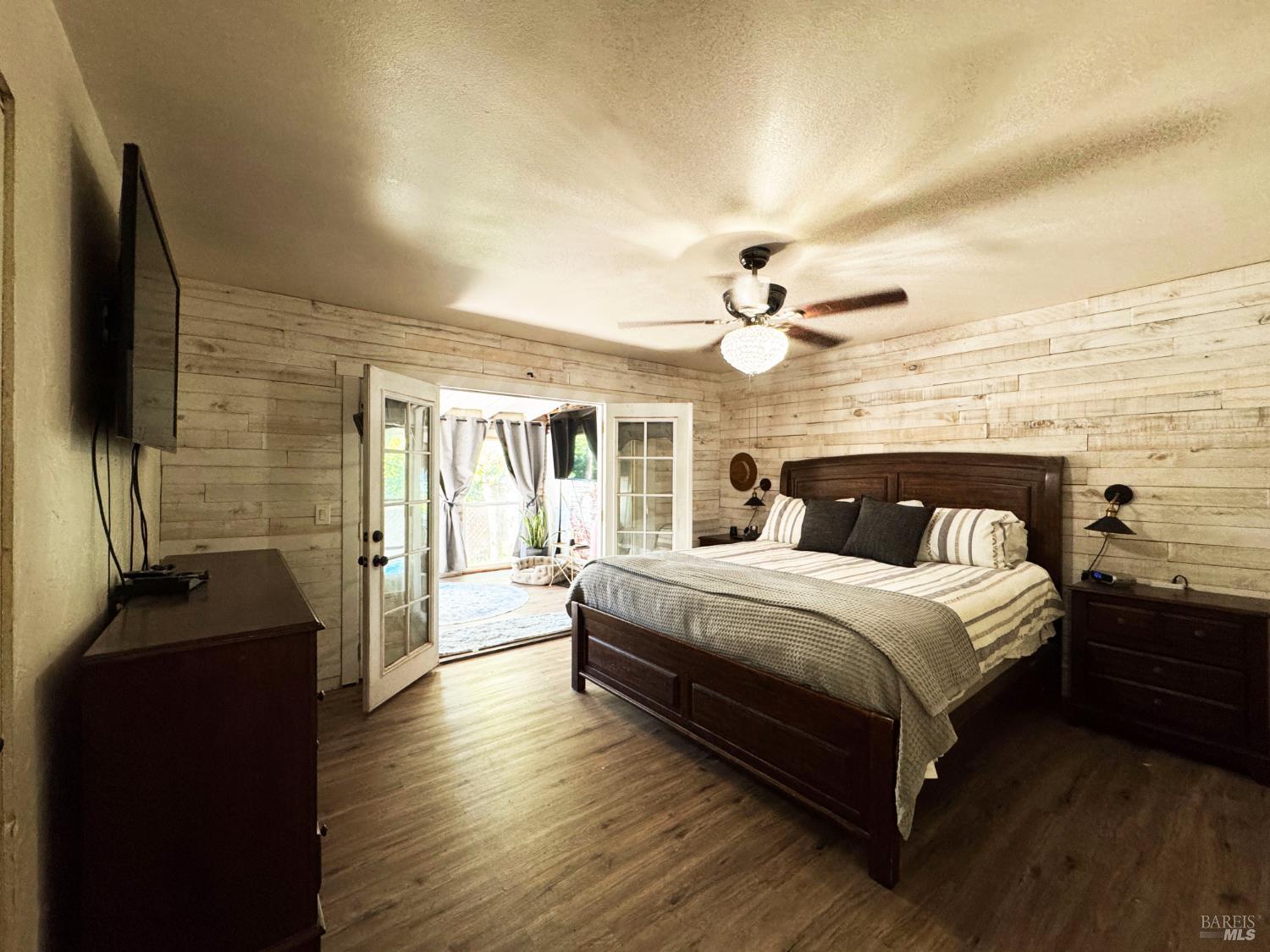 3981 Eastside Calpella Road Ukiah, CA 95482 - Photo 29 of 78 a bedroom with a bed and wooden floor
