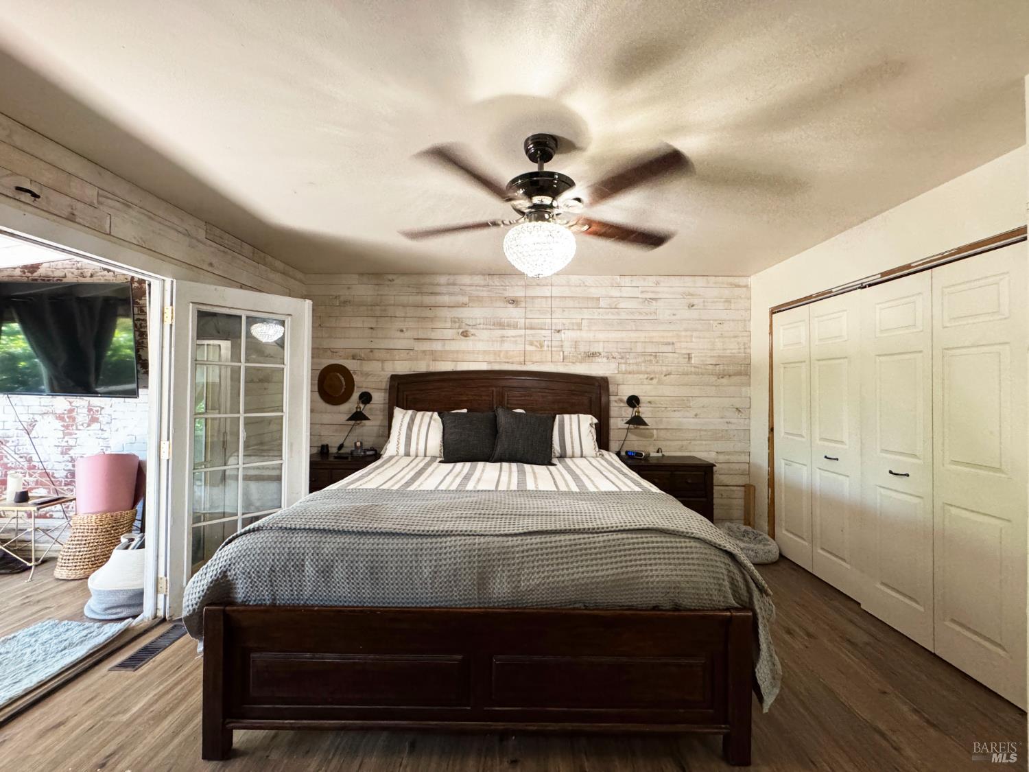 3981 Eastside Calpella Road Ukiah, CA 95482 - Photo 30 of 78 a bedroom with a bed a window and a flat screen tv