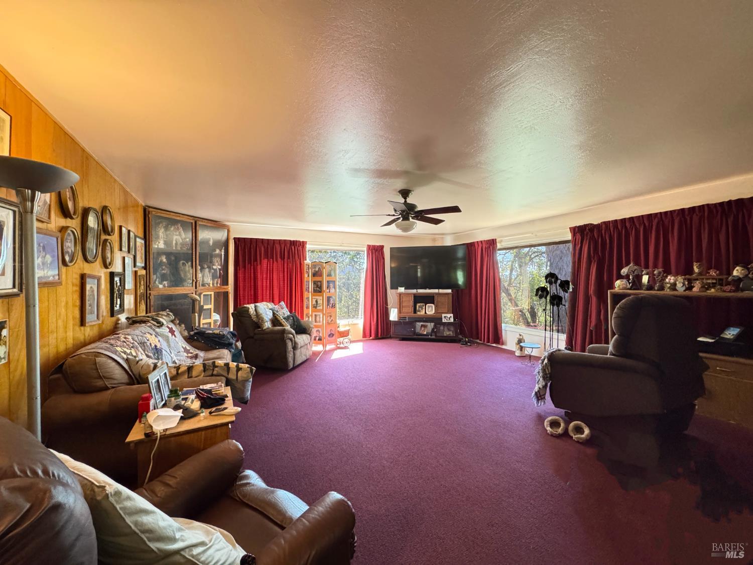 3981 Eastside Calpella Road Ukiah, CA 95482 - Photo 58 of 78 a living room with furniture a ceiling fan and a window