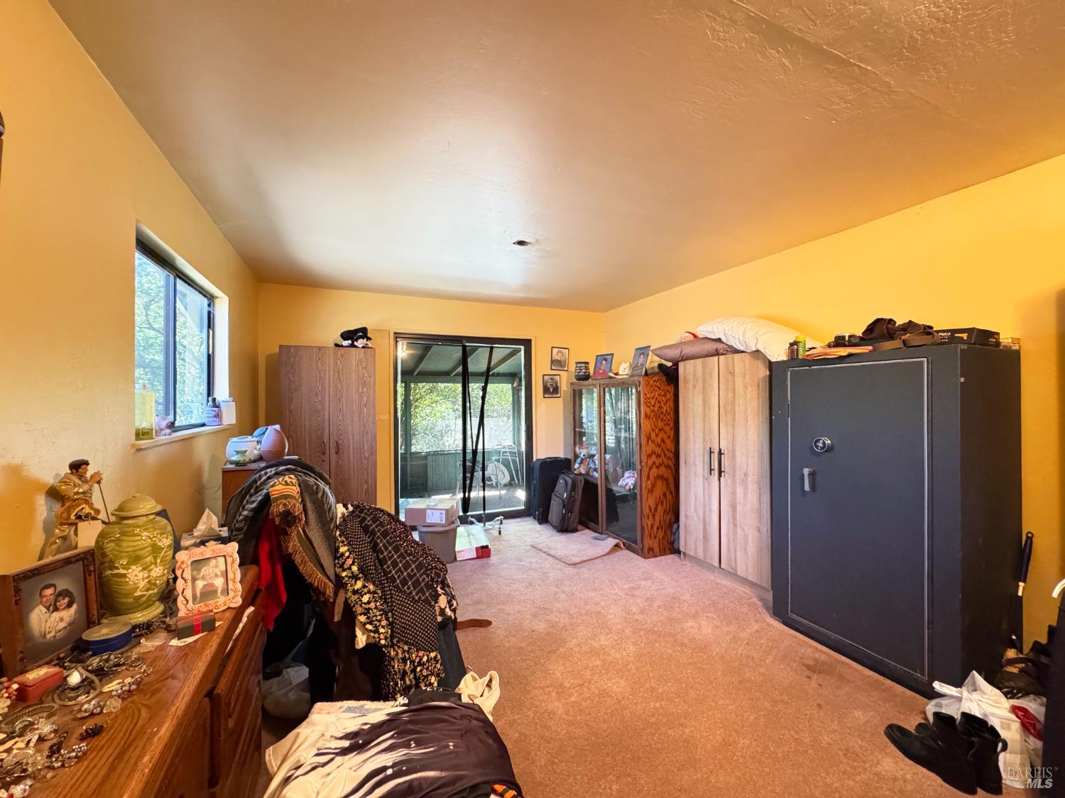 3981 Eastside Calpella Road Ukiah, CA 95482 - Photo 69 of 78 a bed room with a bed and a large window