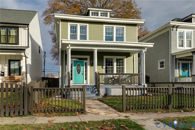 front view of a brick house with a large windows