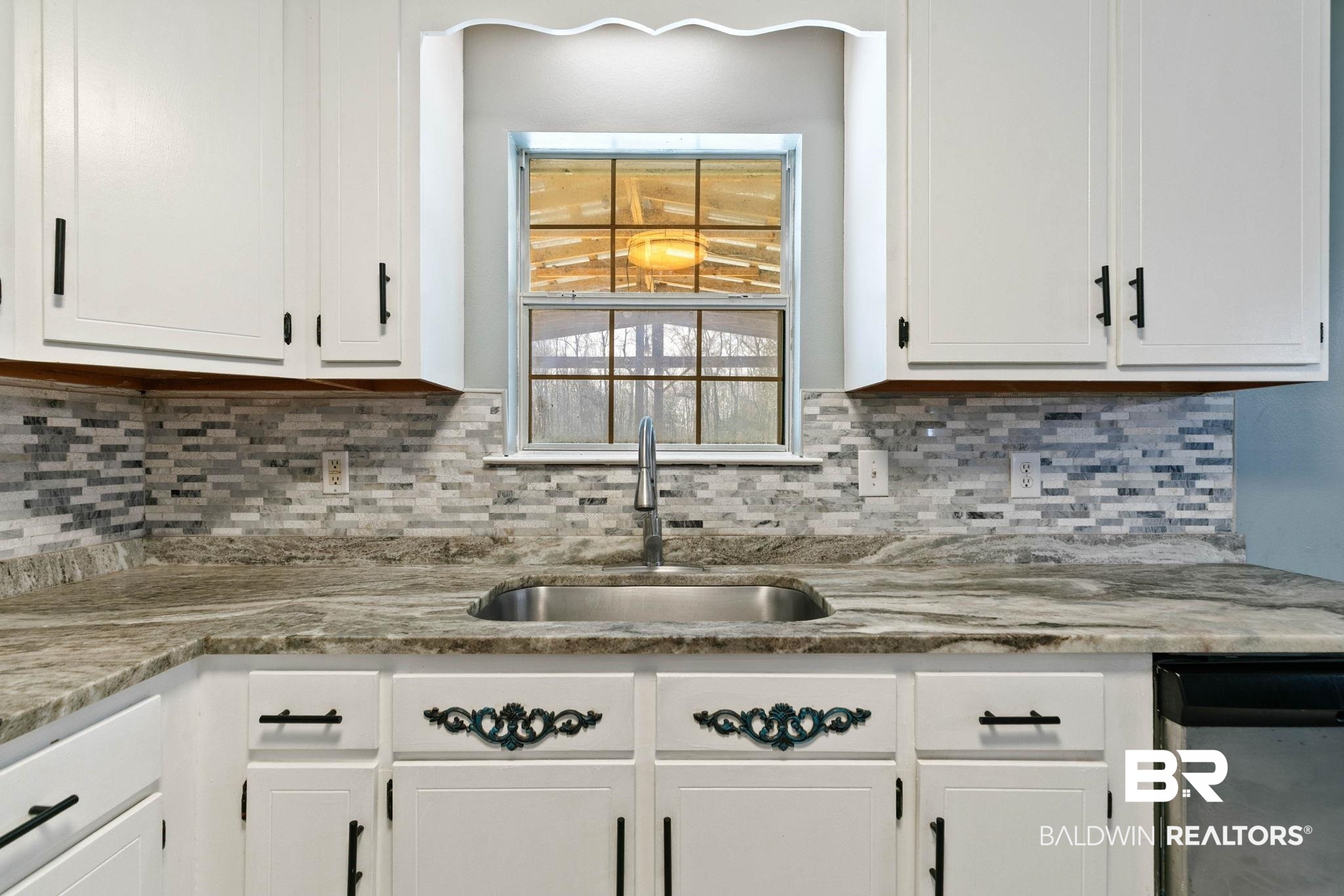 17366 Old Brady Road Bay Minette, AL 36507 - Photo 14 of 43 Kitchen with white cabinetry, light stone countertops, and dishwasher