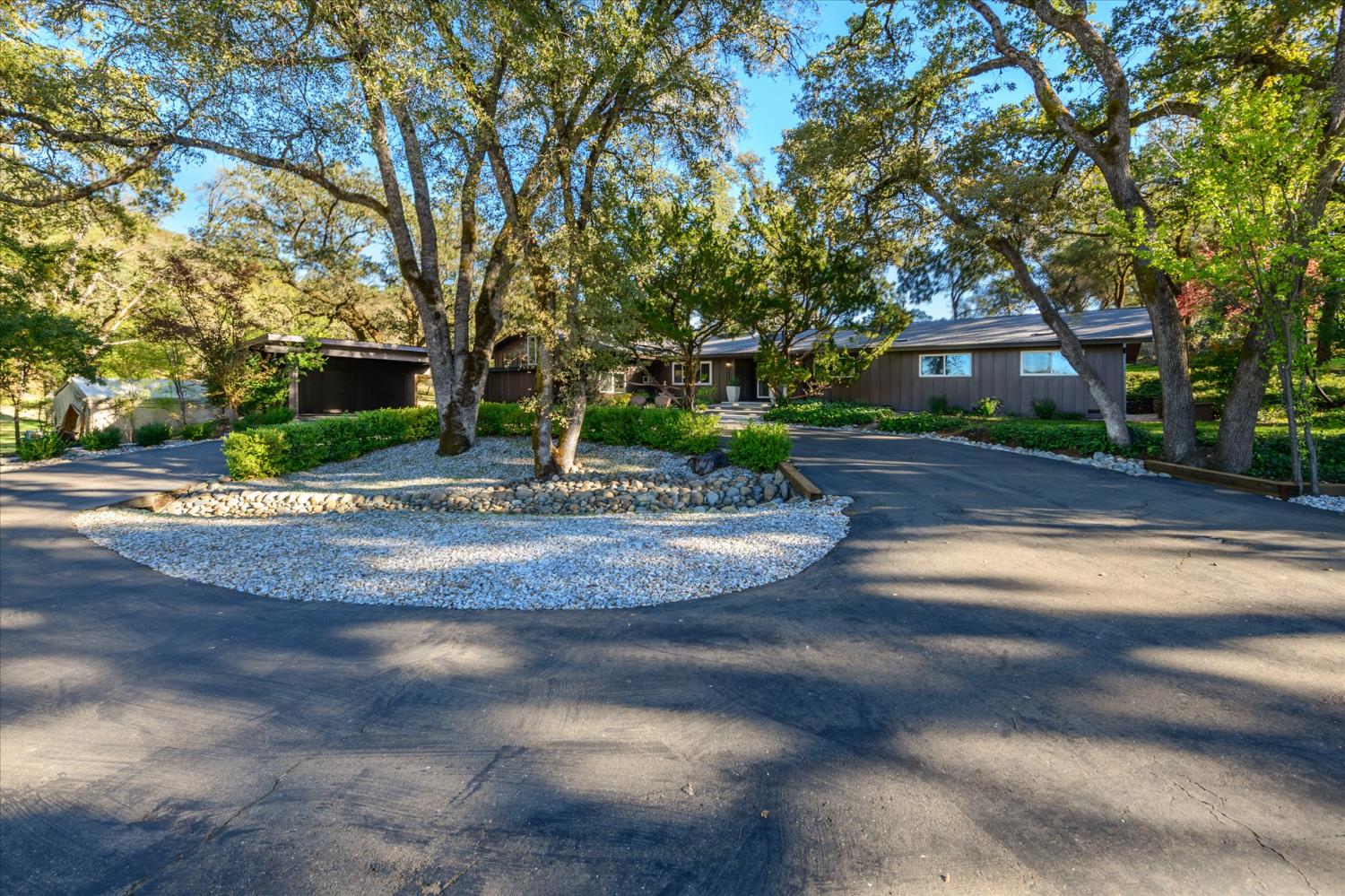 3449 North Shingle Road Shingle Springs, CA 95682 - Photo 1 of 1 a front view of a house with a yard and trees