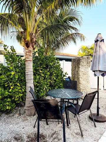 a view of a backyard with a sitting area and furniture