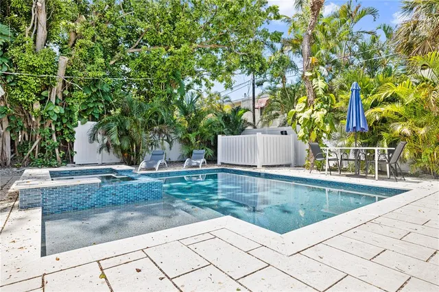 a view of swimming pool with a sitting area