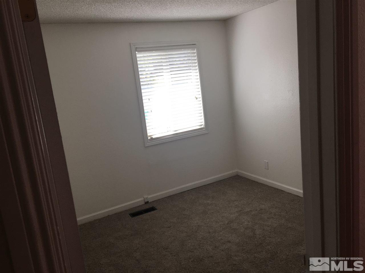 3951 West 7th Street Reno, NV 89503 - Photo 11 of 17 an empty room with a window