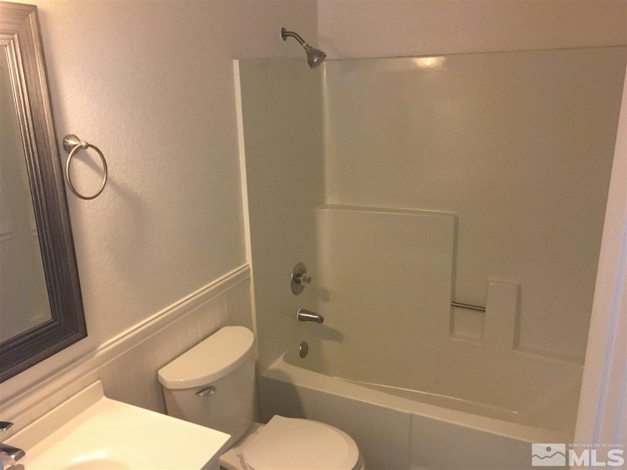 3951 West 7th Street Reno, NV 89503 - Photo 12 of 17 a bathroom with a toilet and a shower