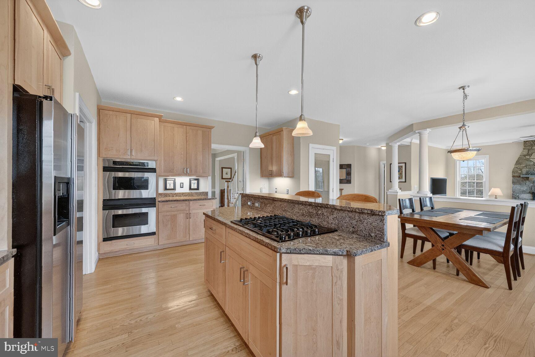 15371 Limestone School Road Leesburg, VA 20176 - Photo 21 of 54 Modern kitchen with warm wood tones.