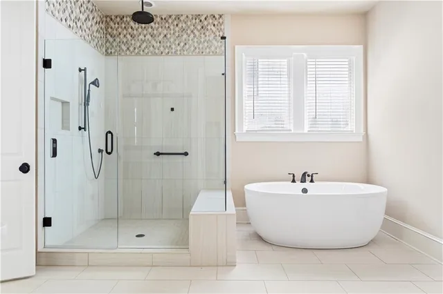a bathroom with a bathtub and shower