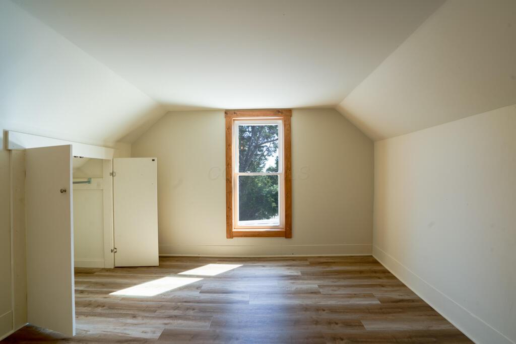 681 Downing Road Stockport, OH 43787 - Photo 18 of 36 Attic Room Empty with Window and Open Cl