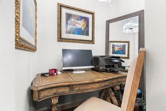 a room with a desk and a workspace