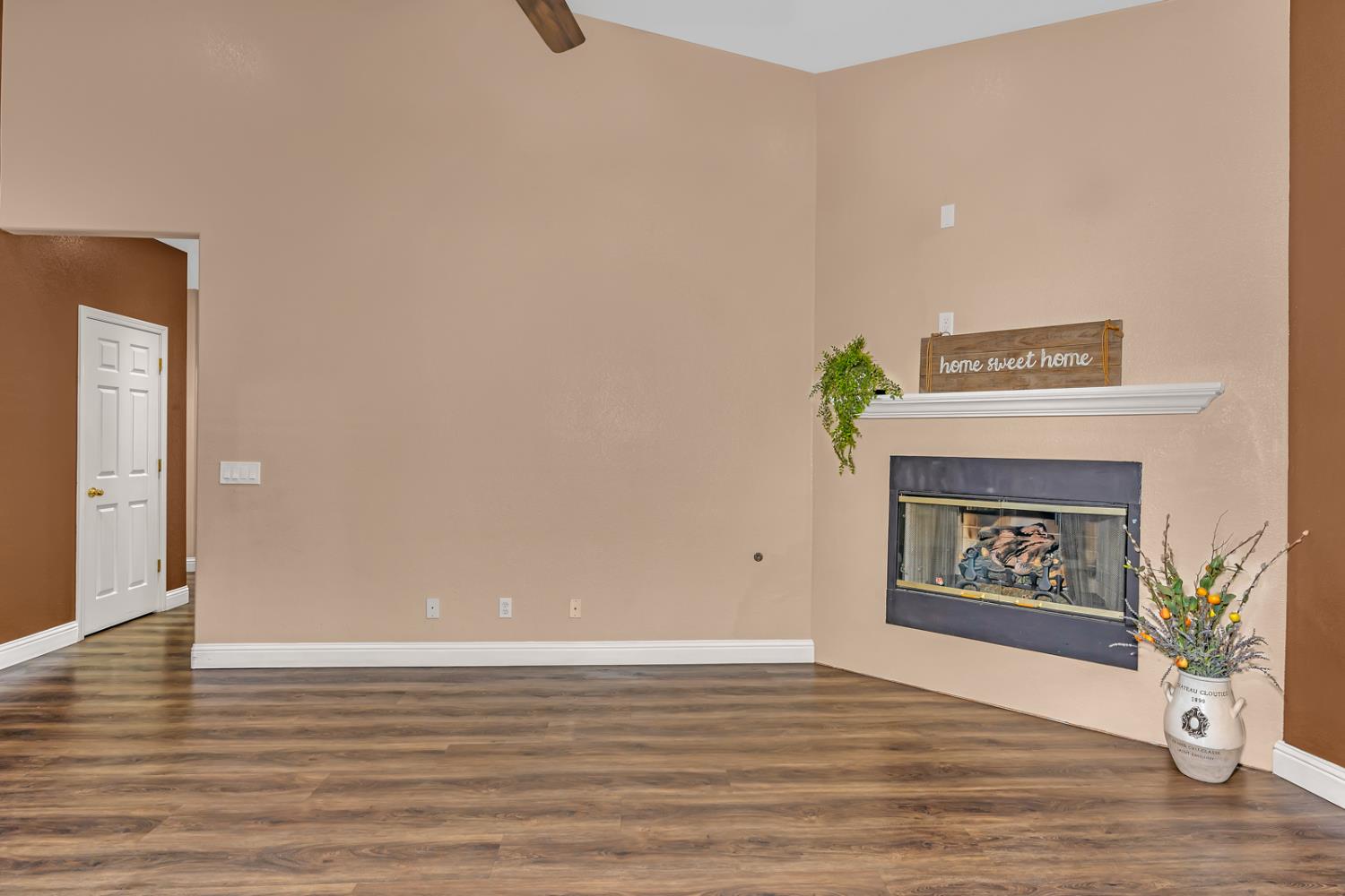 3877 Pintail Court Merced, CA 95340 - Photo 16 of 42 a view of an empty room and wooden floor
