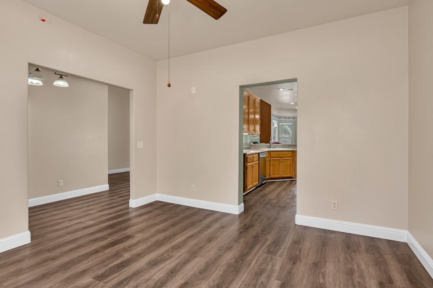 3877 Pintail Court Merced, CA 95340 - Photo 20 of 42 wooden floor in an empty room with a window