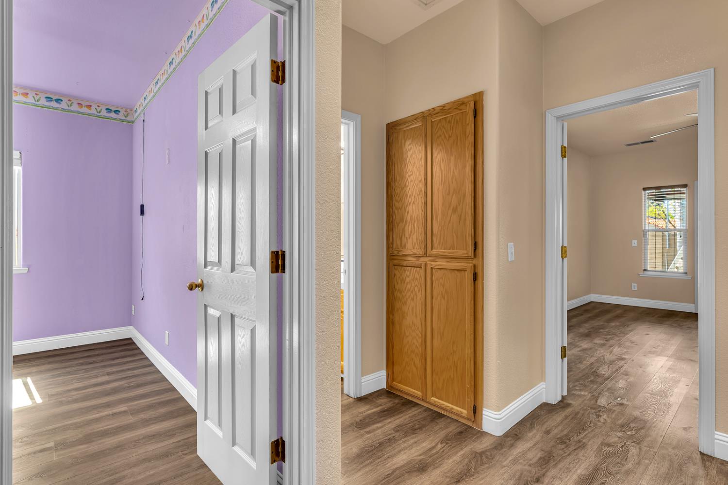 3877 Pintail Court Merced, CA 95340 - Photo 37 of 42 a view of a hallway with wooden floor