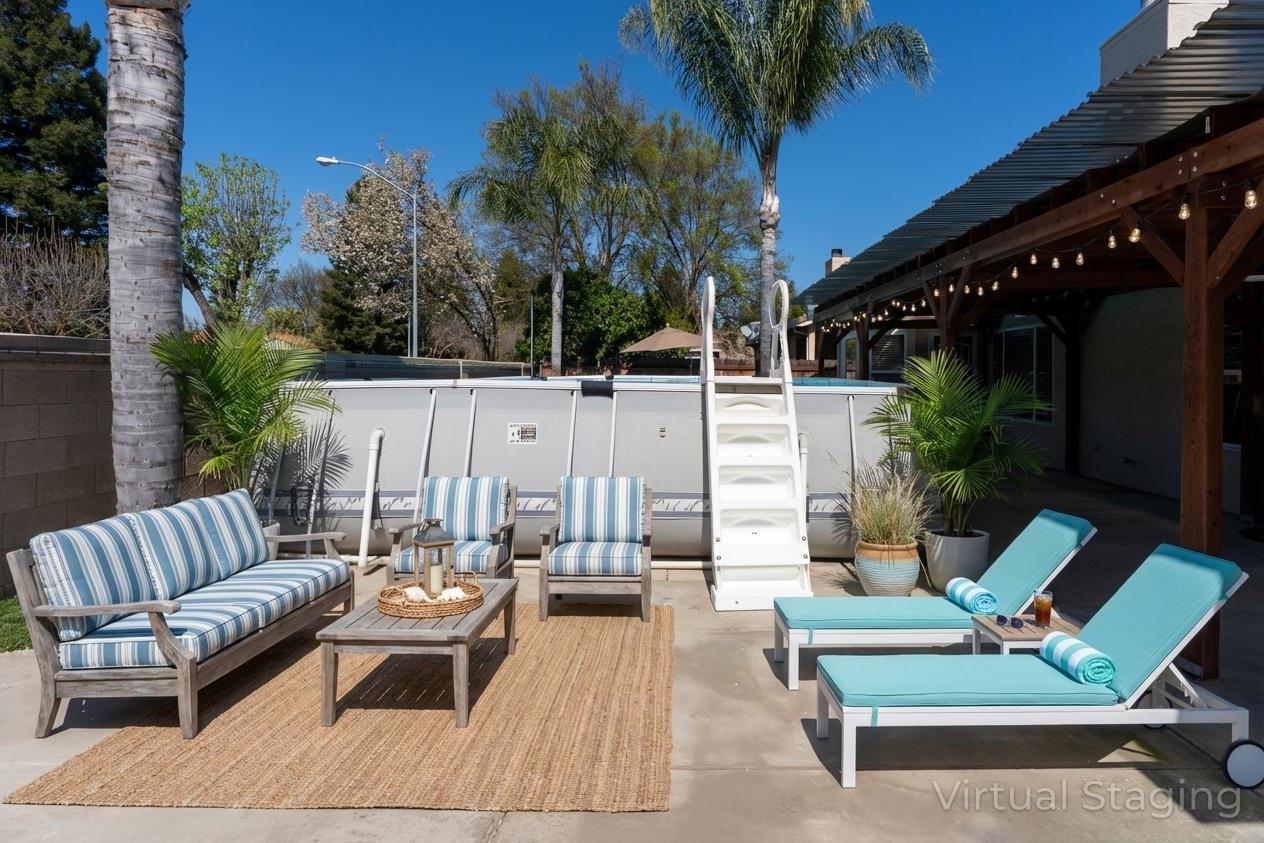 3877 Pintail Court Merced, CA 95340 - Photo 42 of 42 a view of patio with couches table and chairs potted plants and palm tree