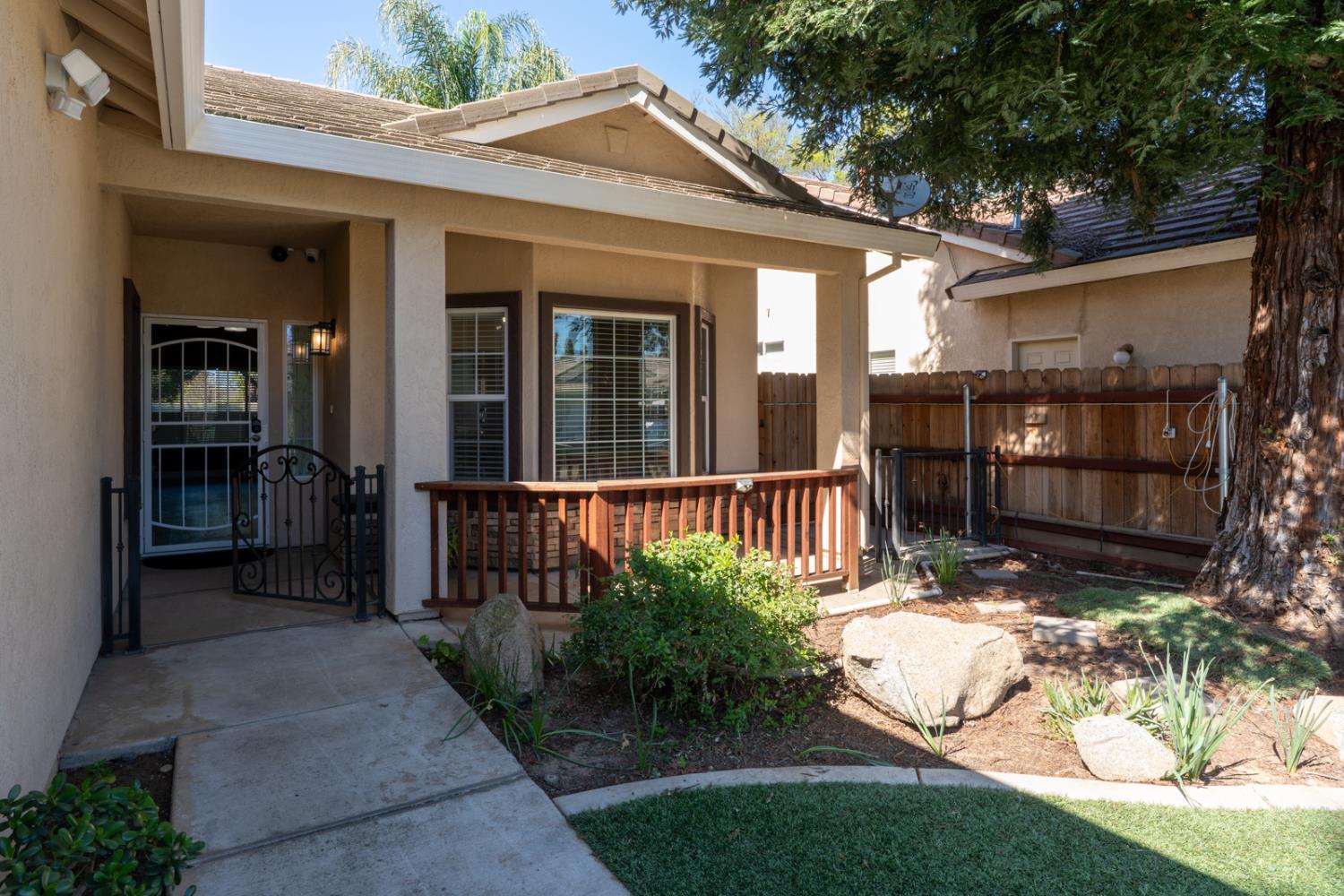 3877 Pintail Court Merced, CA 95340 - Photo 5 of 42 front view of a house with a yard