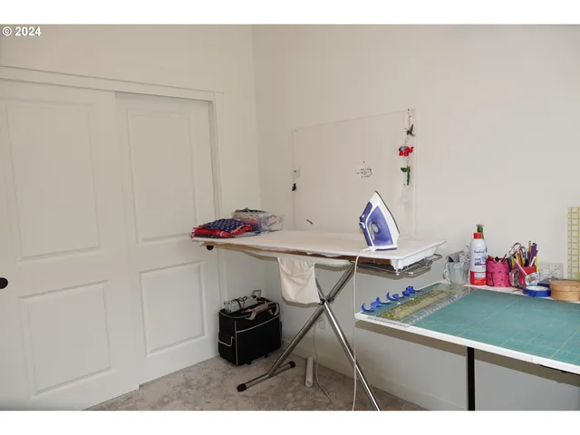 a bedroom with furniture and a window