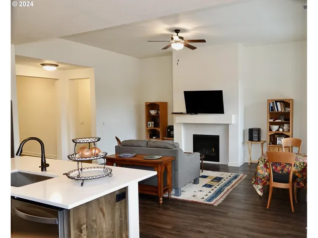 a living room with furniture and fireplace