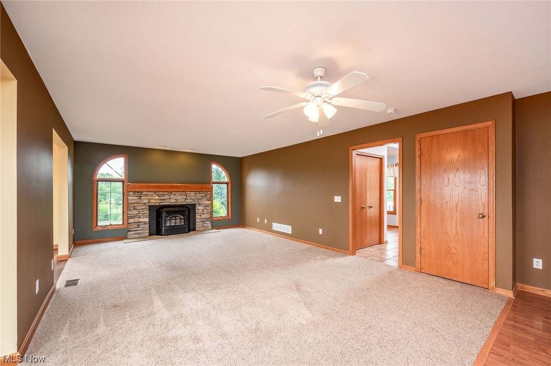 2449 Hartville Road Mogadore, OH 44260 - Photo 18 of 35 Family Room with a pellet stove