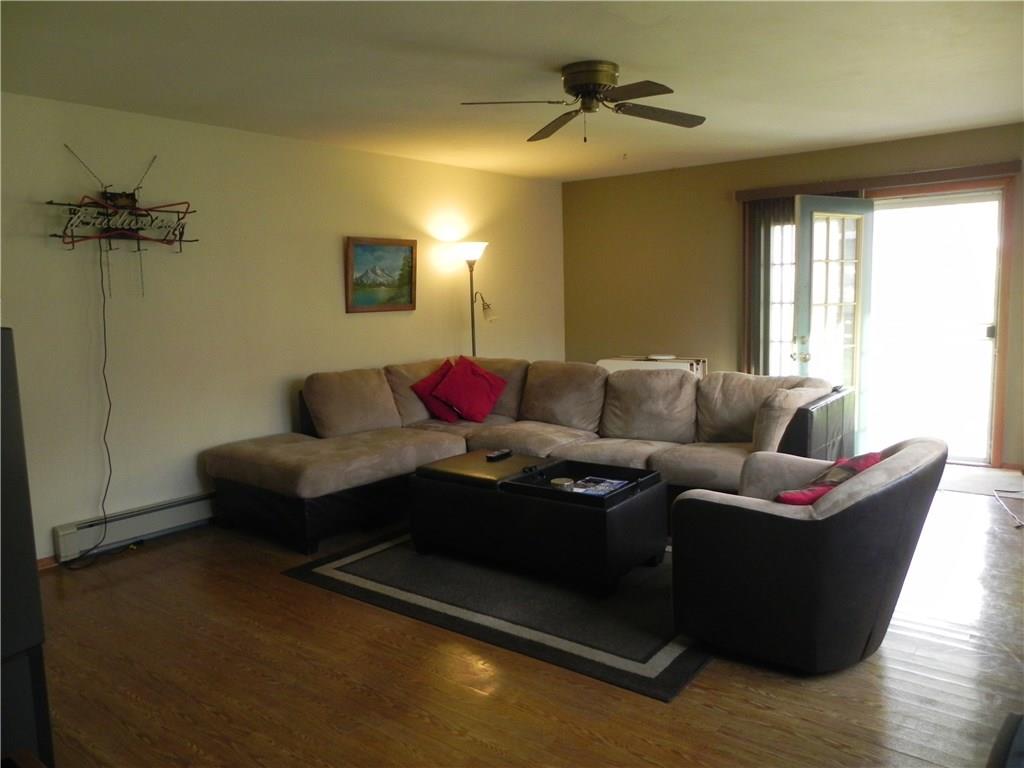 Spacious family room has wide doors leading to the huge deck!  