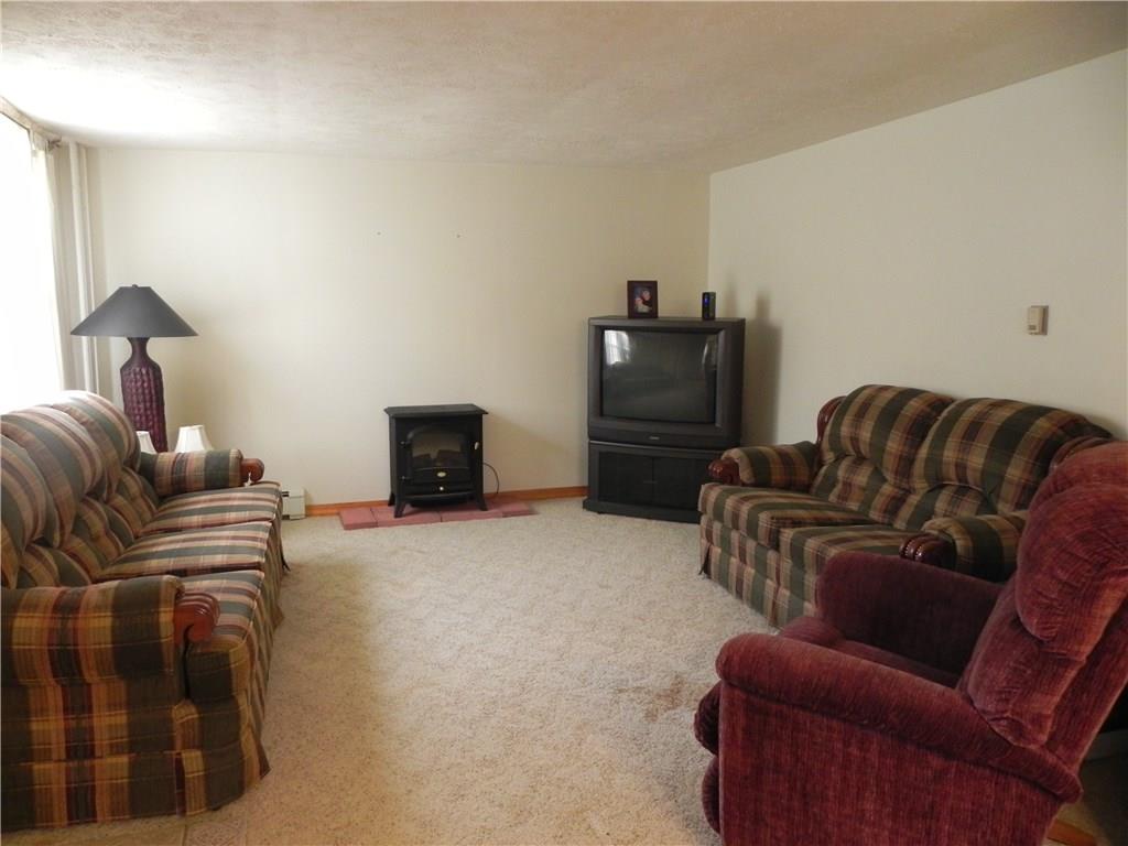 Formal living room is also bursting with natural light! 