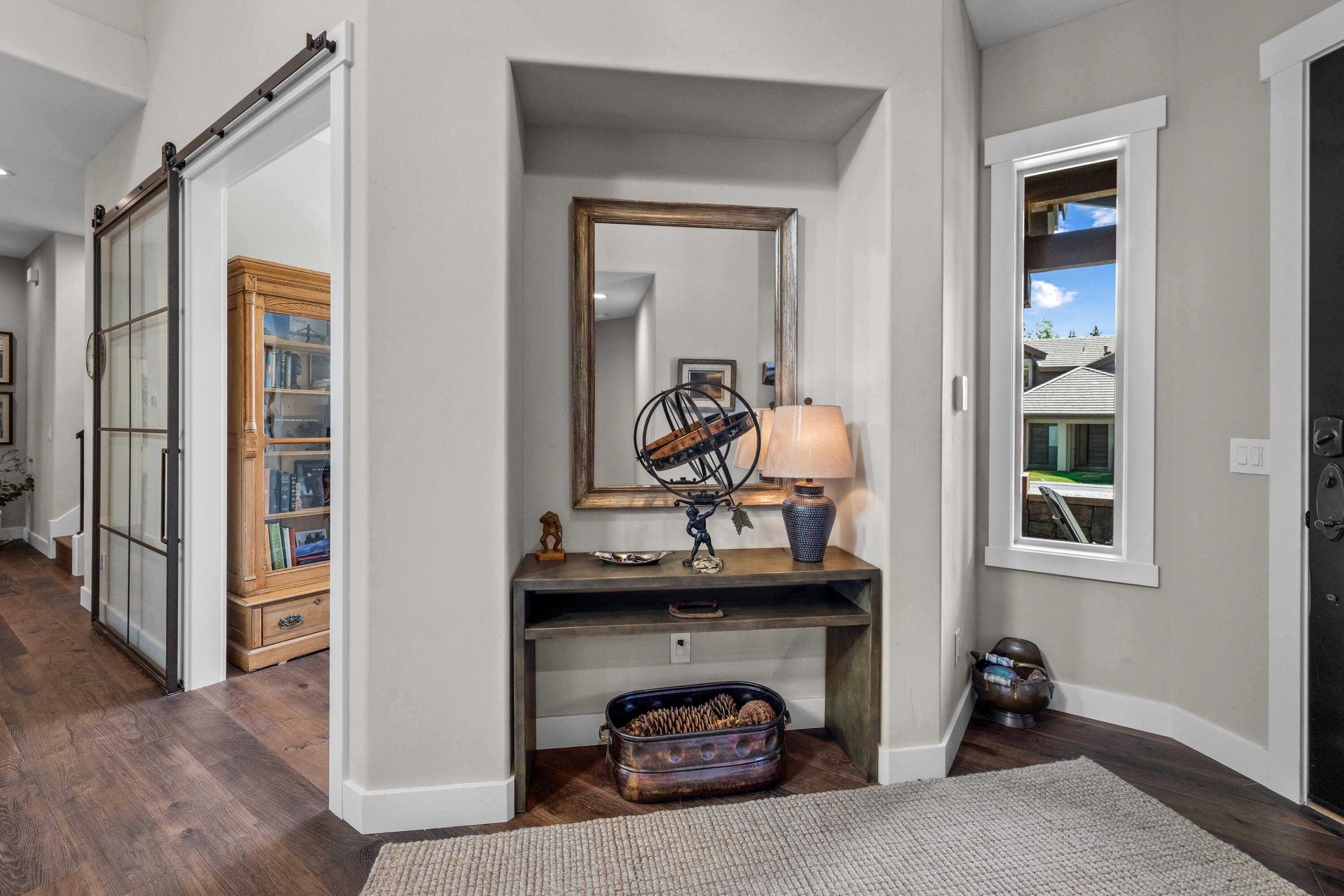 19460 Chip Shot Lane Bend, OR 97702 - Photo 17 of 56 The redesigned entry and hallway create a more open, gracious arrival, with improved flow to the office and guest en-suite while allowing natural light to carry through the home.