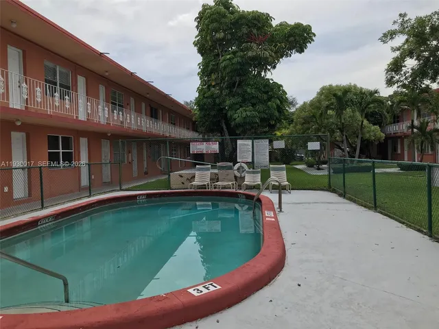 a house view with a sitting space and garden