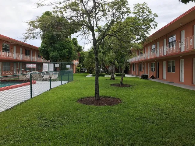 a view of an apartment with a garden