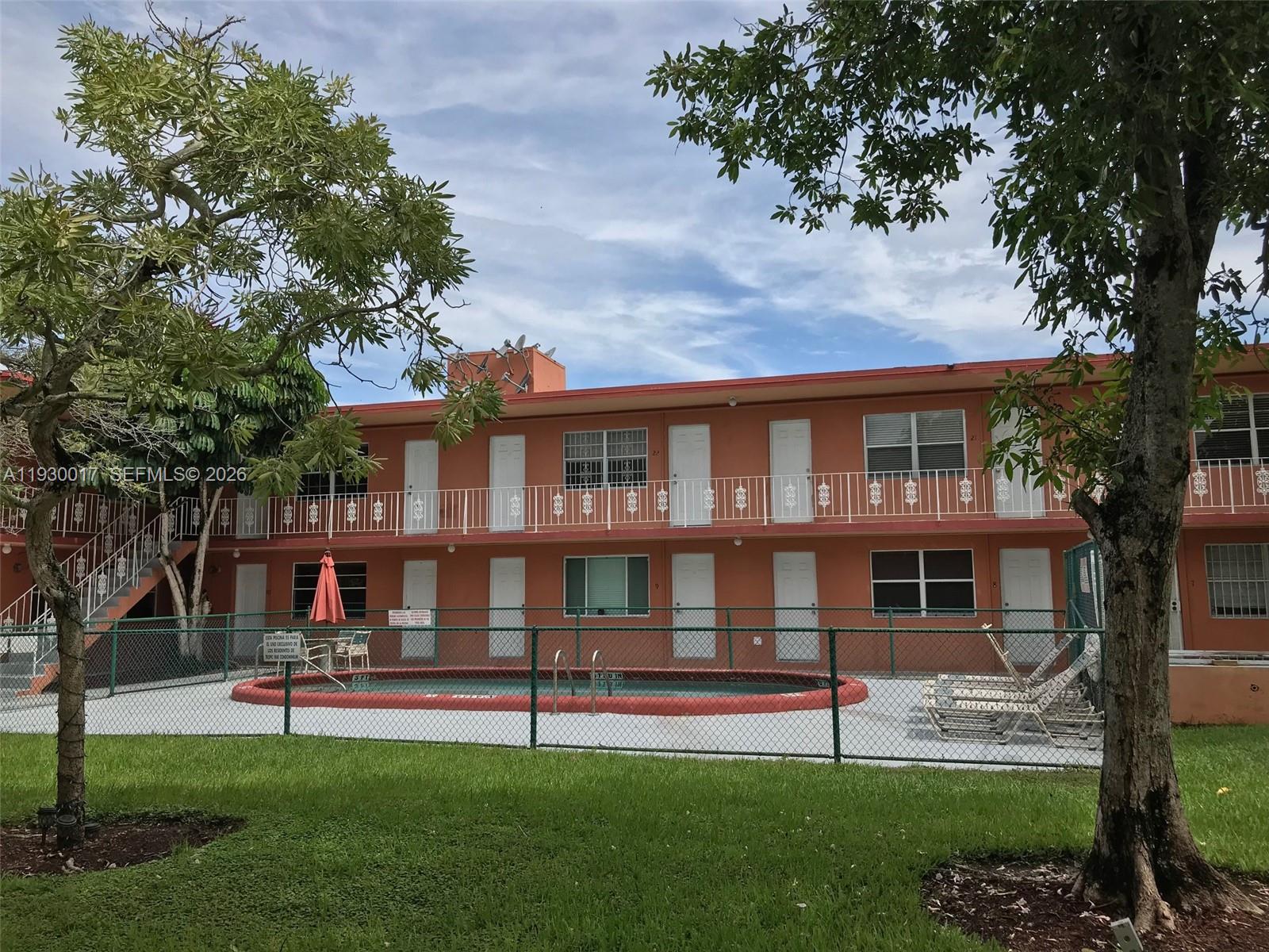 4550 Southwest 67th Avenue, Unit 7 Miami, FL 33155 - Photo 15 of 25 a view of an apartment with a garden