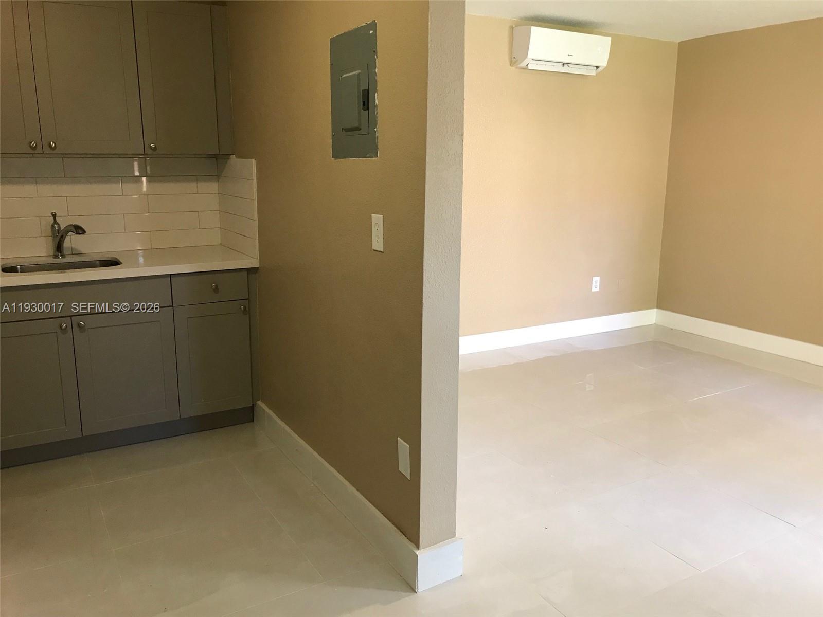 4550 Southwest 67th Avenue, Unit 7 Miami, FL 33155 - Photo 23 of 25 a bathroom with a sink and a mirror