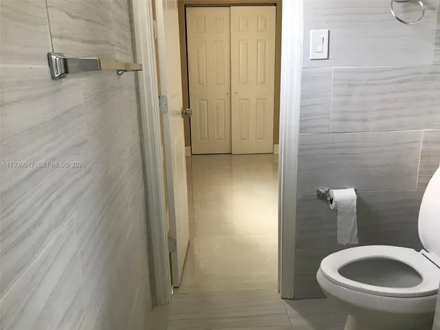 a blue sign that is sitting in front of a house