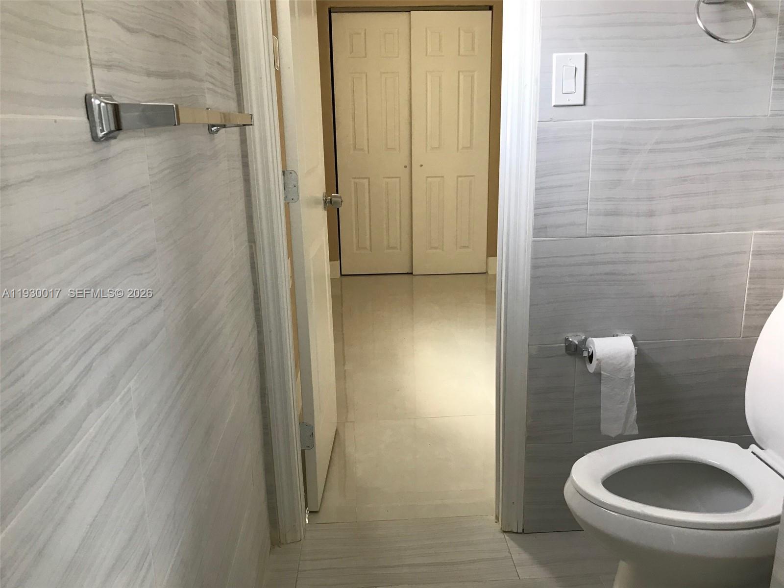 4550 Southwest 67th Avenue, Unit 7 Miami, FL 33155 - Photo 24 of 25 a bathroom with a sink and toilet